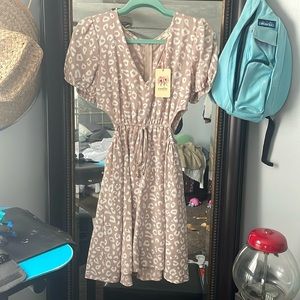 Was bought from a local boutique, is too big and never been worn